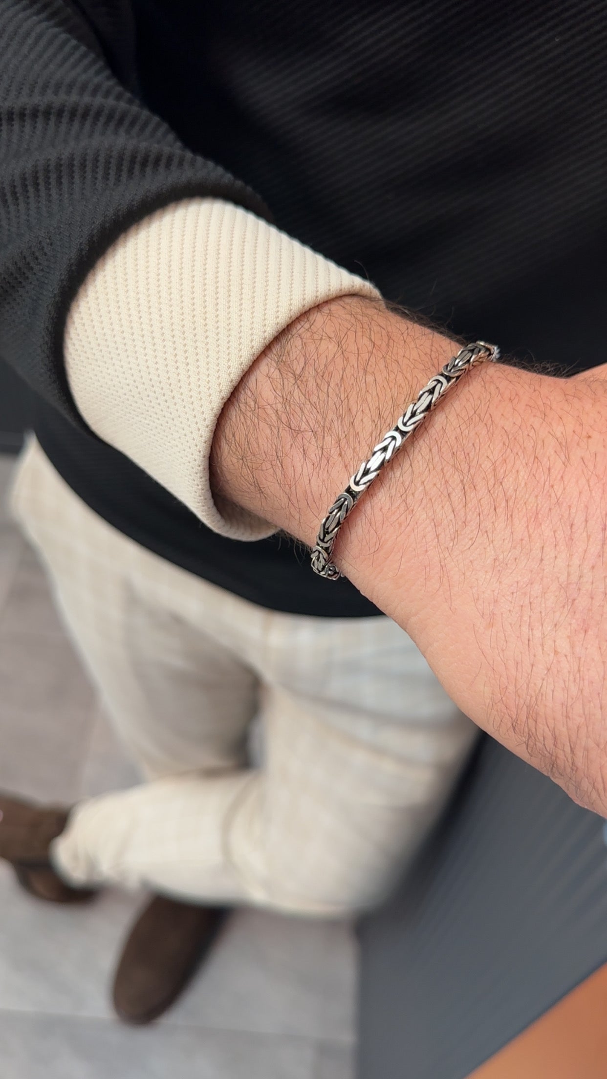 Silberarmband-König